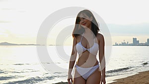 Smiling Young asian woman bikini sexy portrait at seaside beach tropical resting and relaxation travel lifestyle, Happy female fre