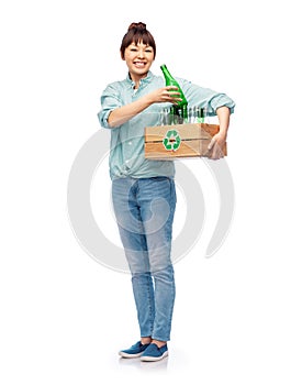 smiling young asian woman sorting glass waste