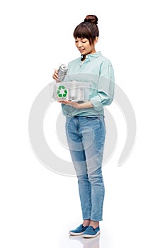 smiling young asian woman sorting metallic waste