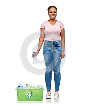 smiling young asian woman sorting plastic waste
