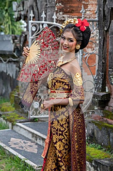 Smiling Young Balinese Girl in Temple