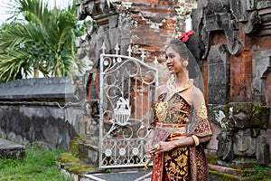 Smiling Young Balinese Girl in Temple