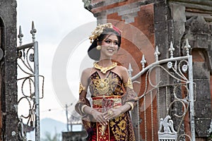 Smiling Young Balinese Girl in Temple