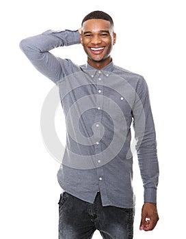 Smiling young black man with hand on head