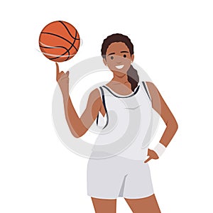 Smiling young black woman athlete spin ball on finger. Happy girl basketball player play with ball. Sport and game activity
