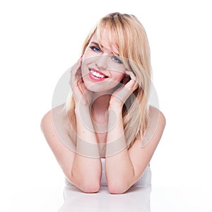 Smiling Young Blond Woman with Head in Hands