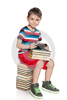 Smiling young boy with a gadget