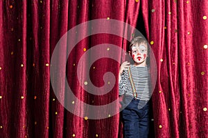 Smiling young boy impatient for his performance