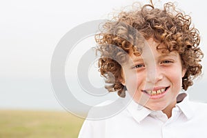 Smiling young boy posing