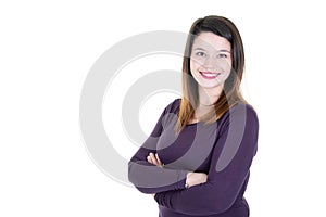 Smiling young brunette woman with crossed arms looking at the camera with white blank copy space