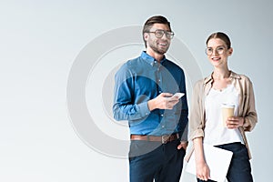 smiling young business colleagues isolated