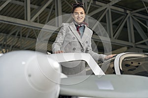 Smiling Young Business Woman Boarding Private Plane