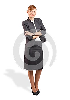 Smiling young business woman with hands crossed