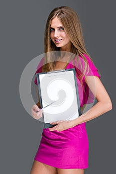 Smiling young business woman showing blank