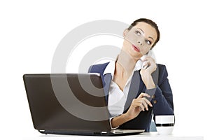 Smiling young business woman speaking on phone