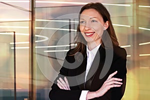 smiling young business woman welcoming guests to a meeting