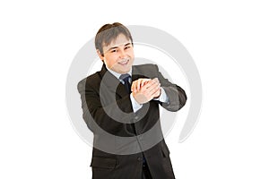 Smiling young businessman cheerfully applauding