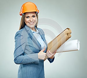 Smiling young businesswoman builder holding paper plan shows thu