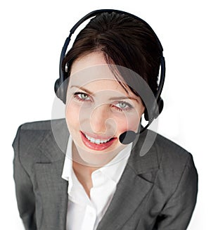 Smiling young businesswoman talking on a headset