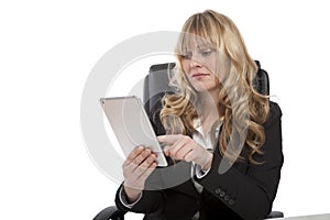 Smiling young businesswoman using her tablet