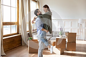 Smiling young couple celebrate relocation at home