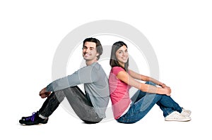 Smiling young couple sitting together