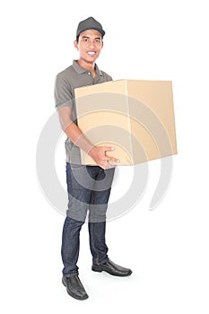 Smiling young delivery man holding a cardbox