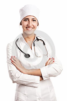 Smiling young doctor with stethoscope over white