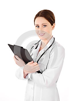 Smiling young doctor woman with a stethoscope and plane table