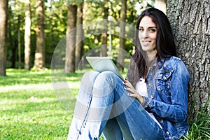 Smiling young female with digital tablet