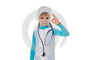 Smiling young female doctor wearing the stethoscope showing okay sign with fingers