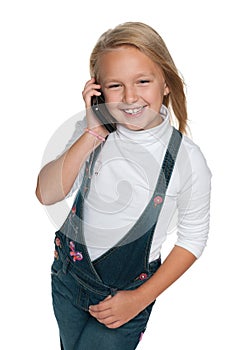 Smiling young girl with a cell phone