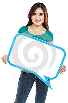 Smiling young girl holding blank text bubble in specs