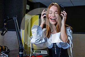 Smiling young girl listening to music