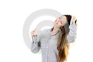 Smiling young girl with morning coffee