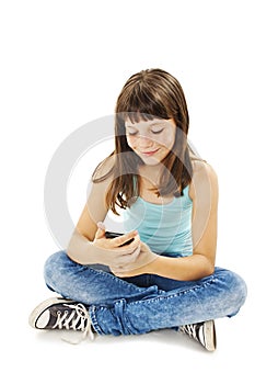 Smiling young girl reading sms on your cell phone