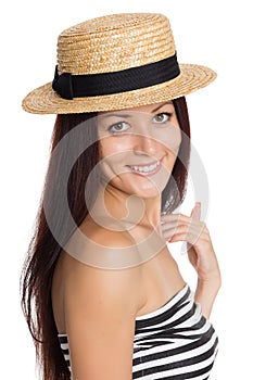 Smiling young girl in a straw hat