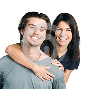 Smiling young latin couple piggyback