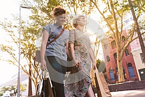 Young lesbian couple enjoying a day shopping in the city