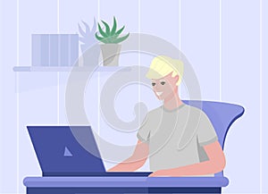 Smiling young male sitting at the desk and looking to laptop. Online education concept. Good design for chatting, online