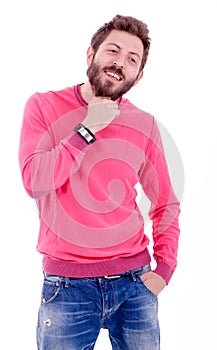 Smiling young man with beard posing