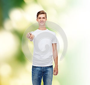 Smiling young man in blank white t-shirt