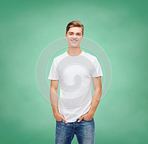 Smiling young man in blank white t-shirt