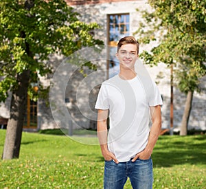 Smiling young man in blank white t-shirt