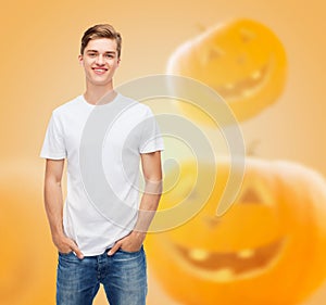 Smiling young man in blank white t-shirt