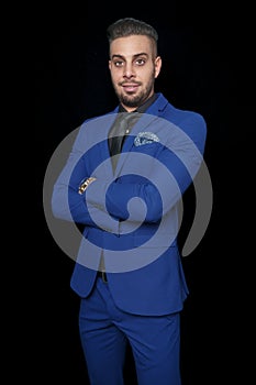 Smiling young man in a blue suit