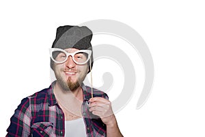 Smiling young man with decorative glasses isolated