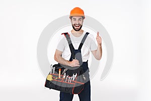 Smiling young man holding bag with equipment