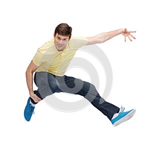 Smiling young man jumping in air