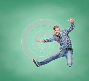 Smiling young man jumping in air